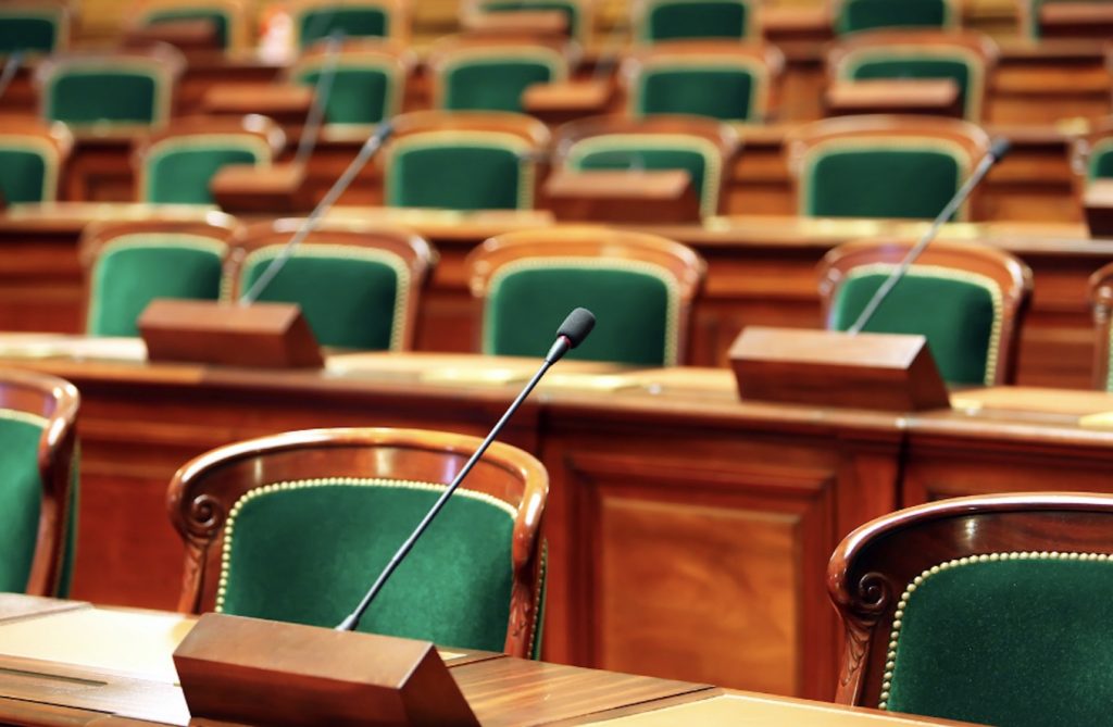 Green chairs in a legislative chamber